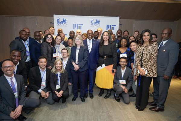 President Mokgweetsi Masisi of Botswana stands with President Kornbluth and fellows at the Legatum Center at MIT.