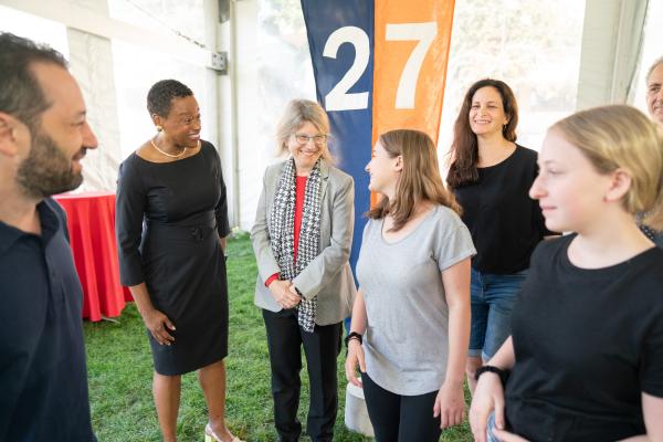 Chancellor Melissa Nobles (left) and President Kornbluth (right) chat with incoming students at the Convocation ceremony.